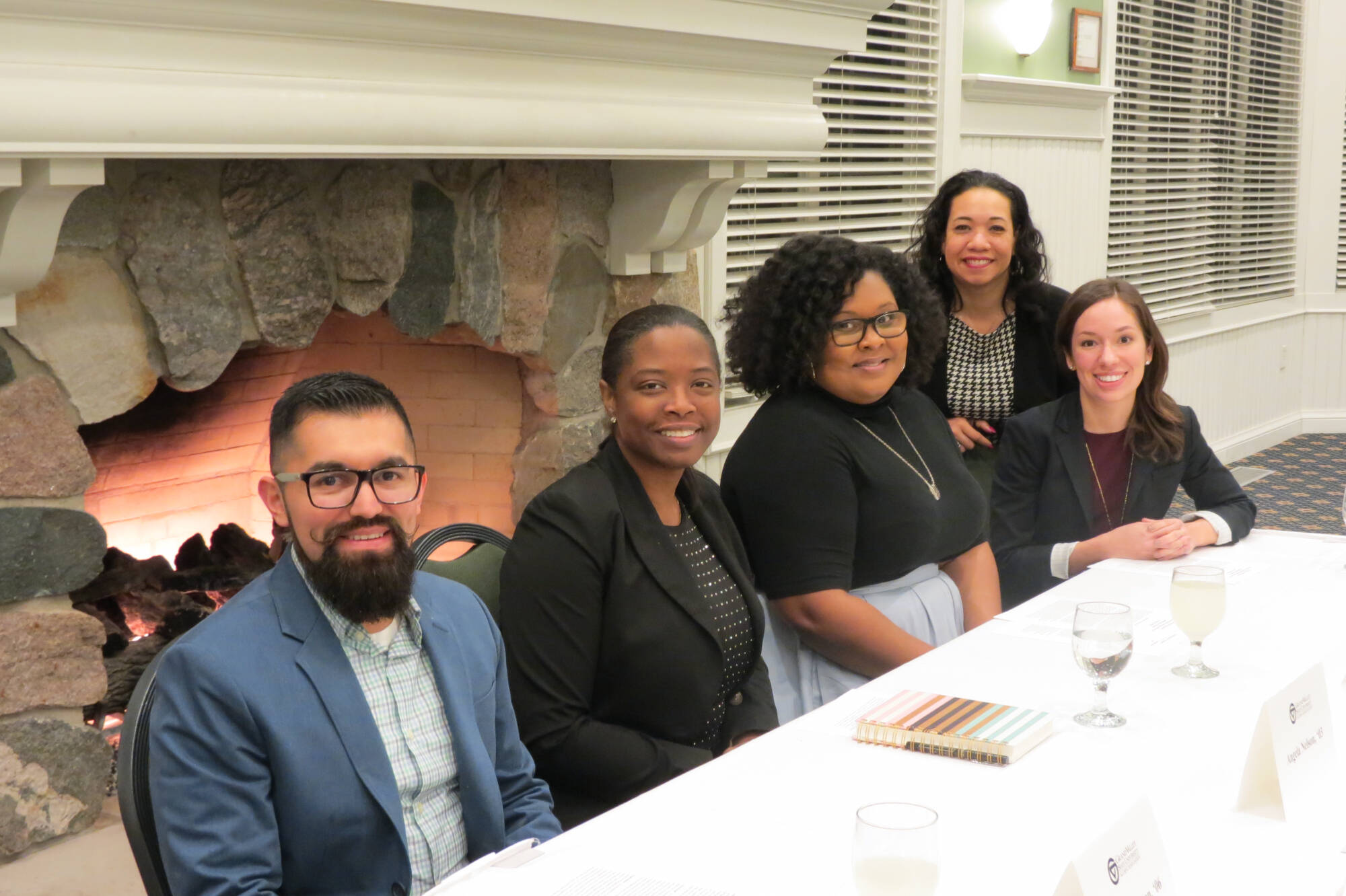 Five African American Latine alumni at a discussion